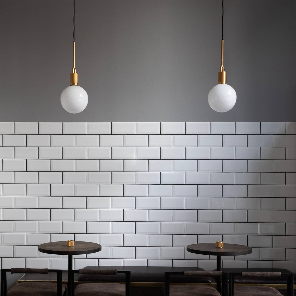 Buster + Punch Forked Pendants over a bar