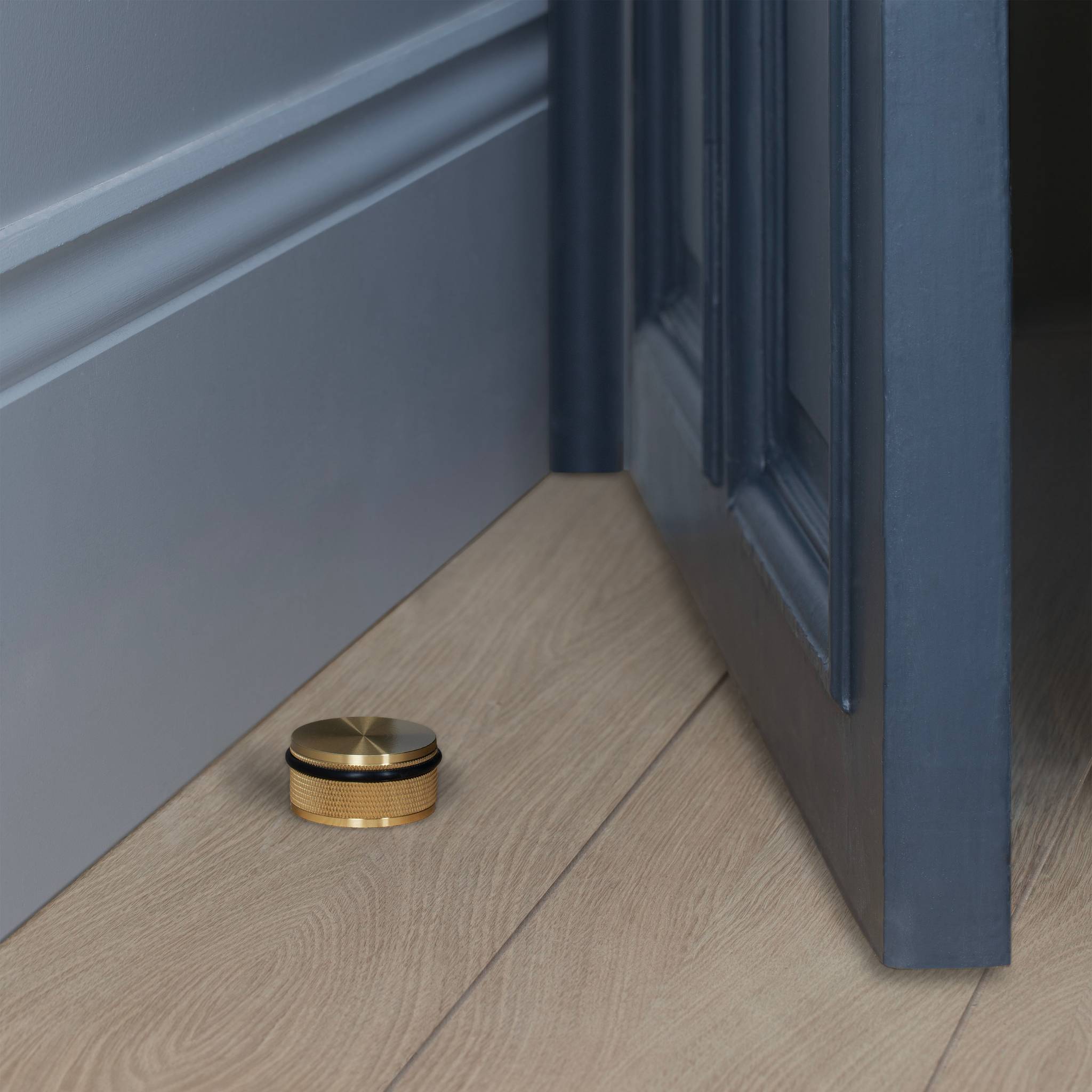 Buster + Punch Door Stop Floor Mounted Cross in Brass lifestyle