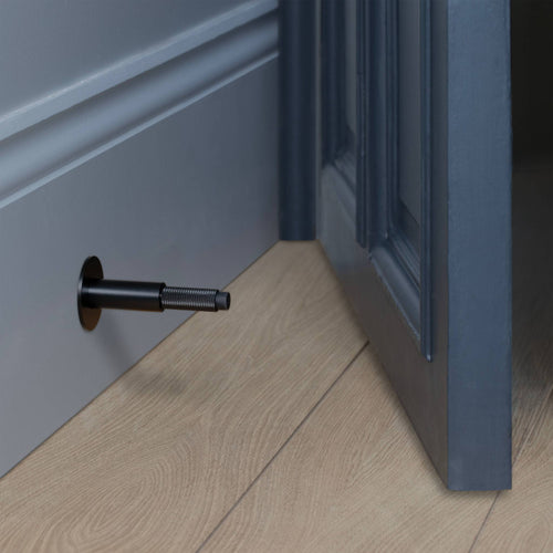 Buster + Punch Door Stop Wall Cross in Black lifestyle