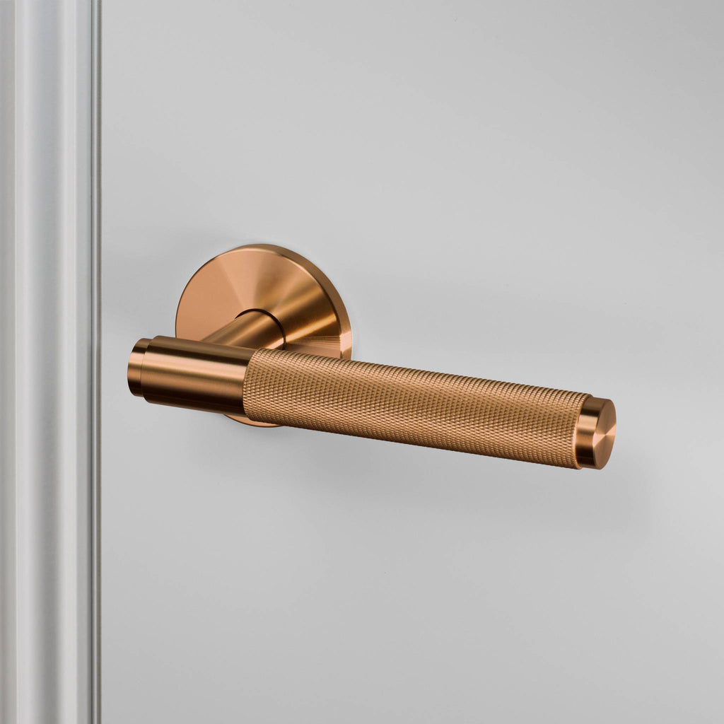 Buster + Punch Door Handle Set Cross Knurl Warm Sunset angle by Araco Interiors