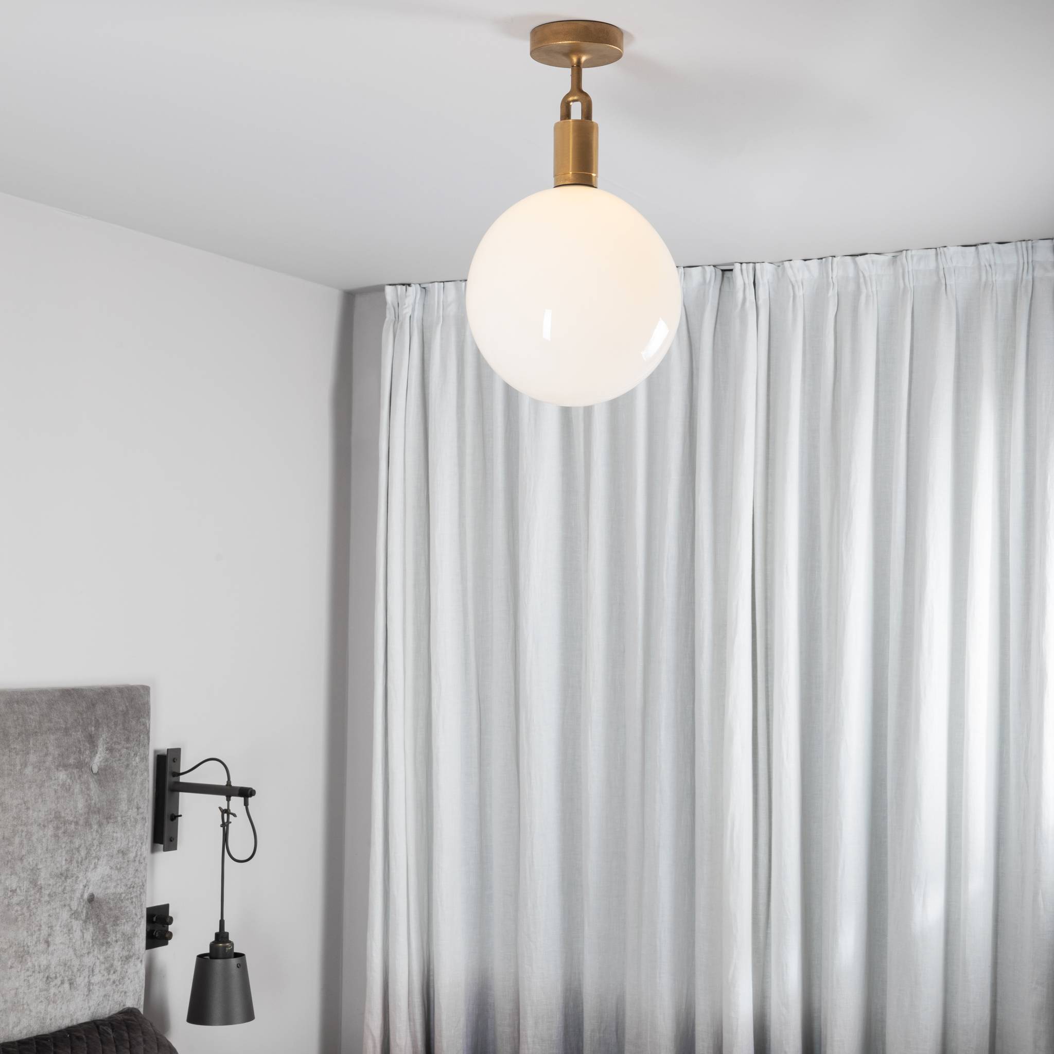 Buster + Punch Forked Ceiling Light Opal Glass Globe Large styled in a luxury interior | Araco Interiors