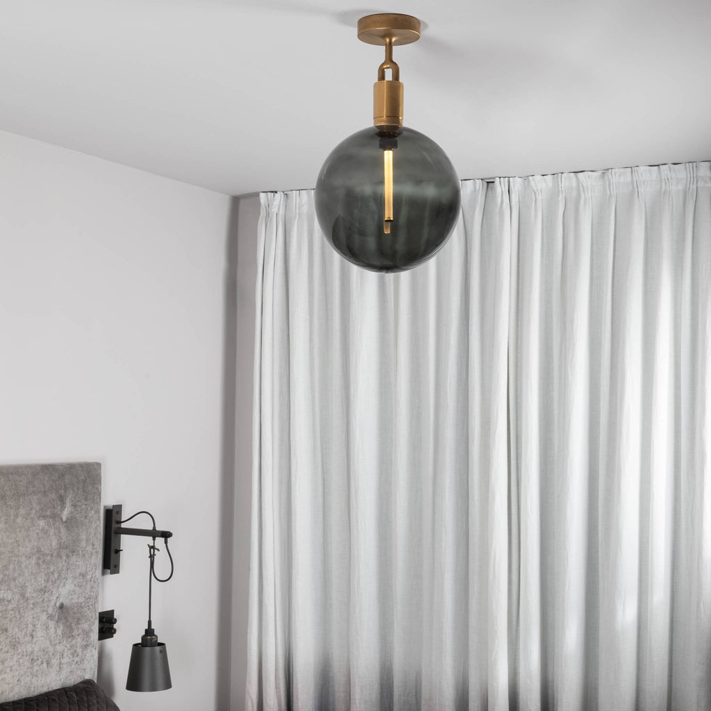 Buster + Punch Forked Ceiling Light Smoked Glass Globe Large styled in a luxury interior | Araco Interiors
