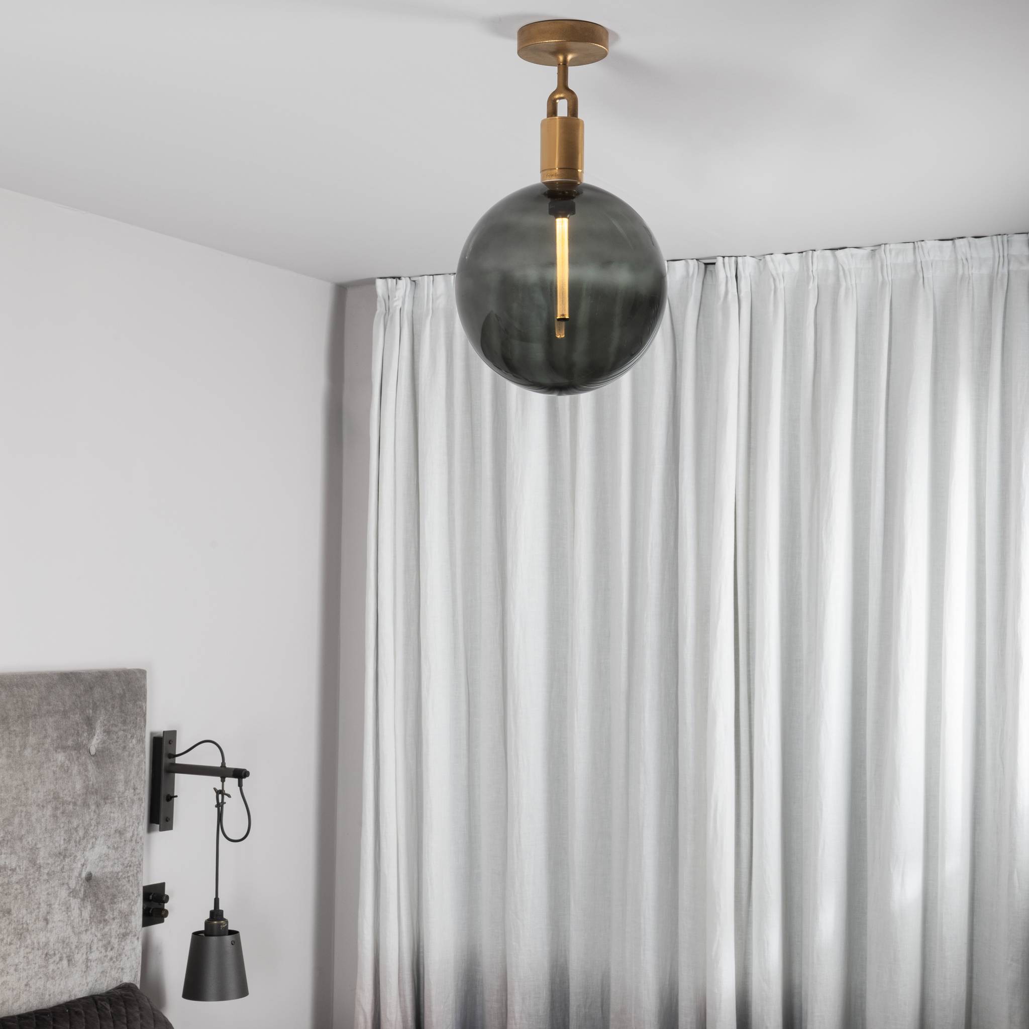 Buster + Punch Forked Ceiling Light Smoked Glass Globe Large styled in a luxury interior | Araco Interiors