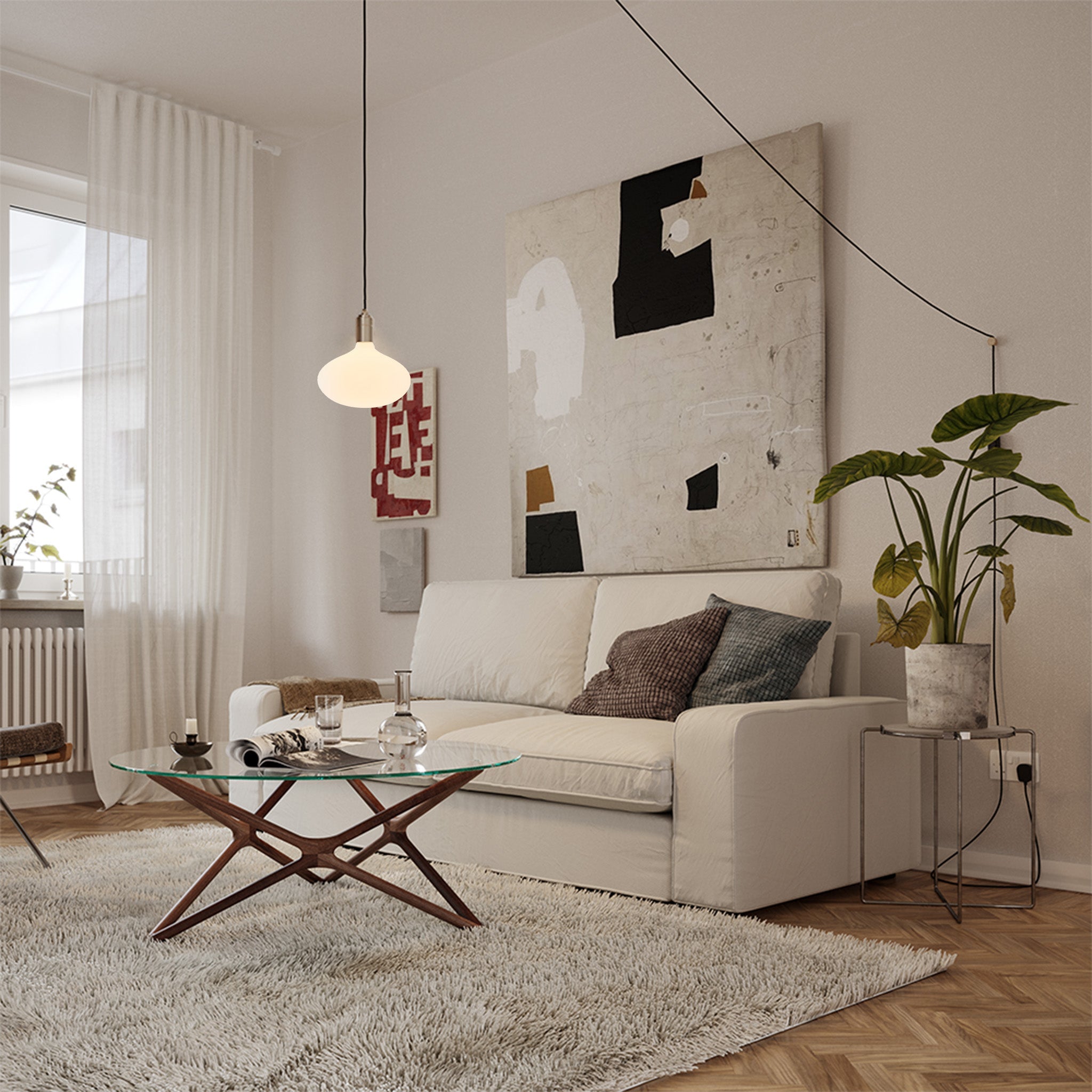 Tala Oval II Plug-In Pendant in Graphite in a styled interior setting