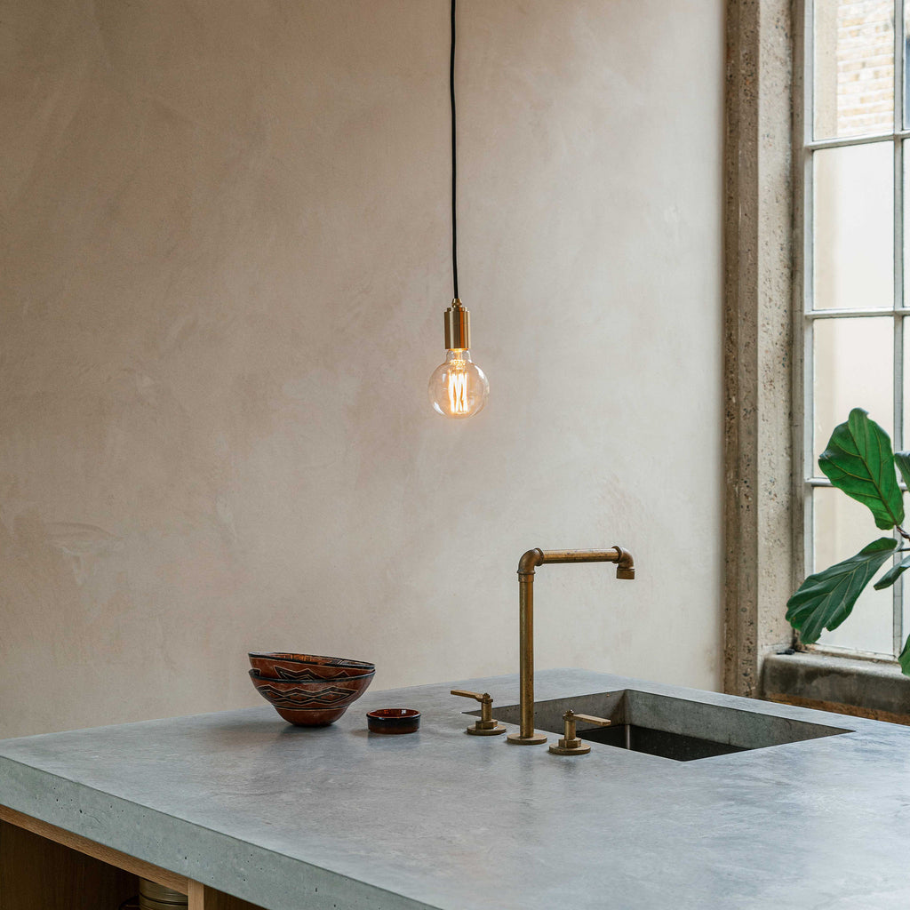 Tala Elva Pendant Light Non-Tinted in Graphite in a styled interior setting