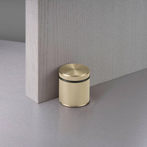 Buster + Punch Freestanding Door Stop Linear in Brass at door
