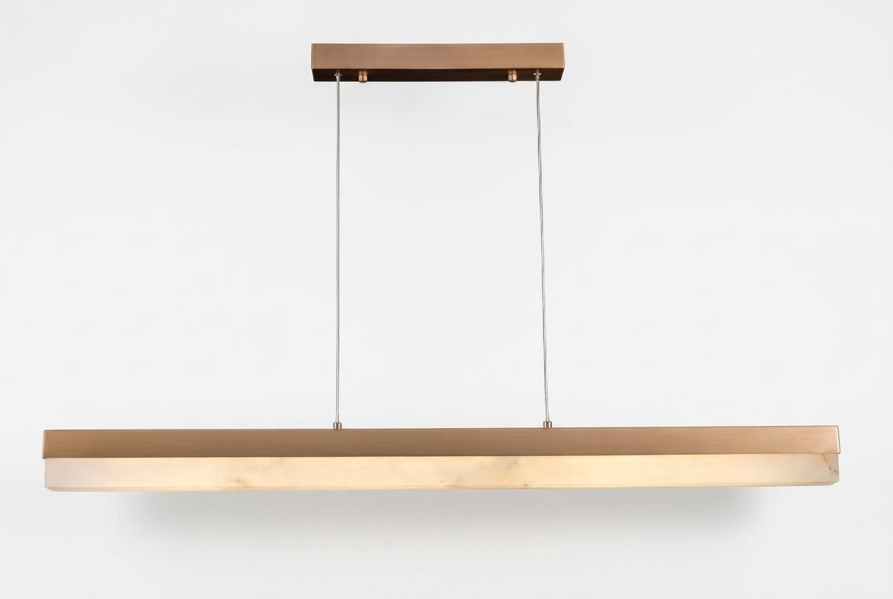 Araco Lumière Frozen Fira linear natural alabaster pendant light over a kitchen island