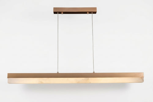 Araco Lumière Frozen Fira linear natural alabaster pendant light over a kitchen island