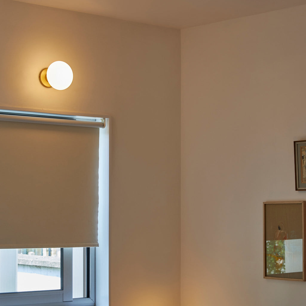 Tala Lochan Wall Light in Brass + Oval Dim to Warm in a styled interior setting
