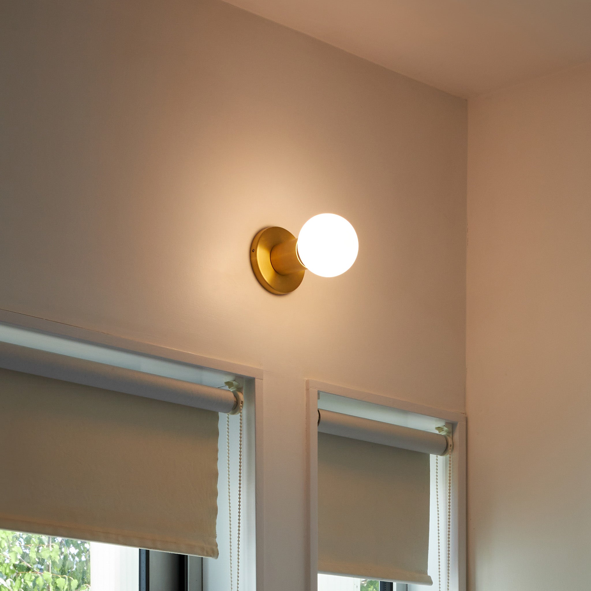 Tala Lochan Wall Light in Brass + Sphere III in a styled interior setting
