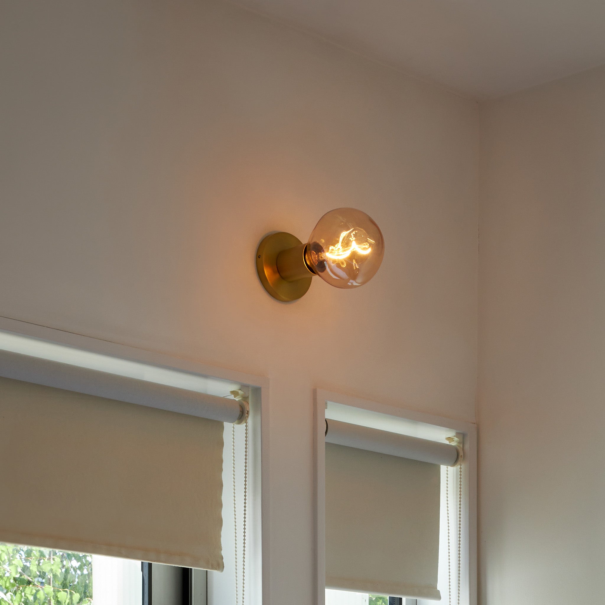 Tala Lochan Wall Light in Brass + Voronoi I in a styled interior setting
