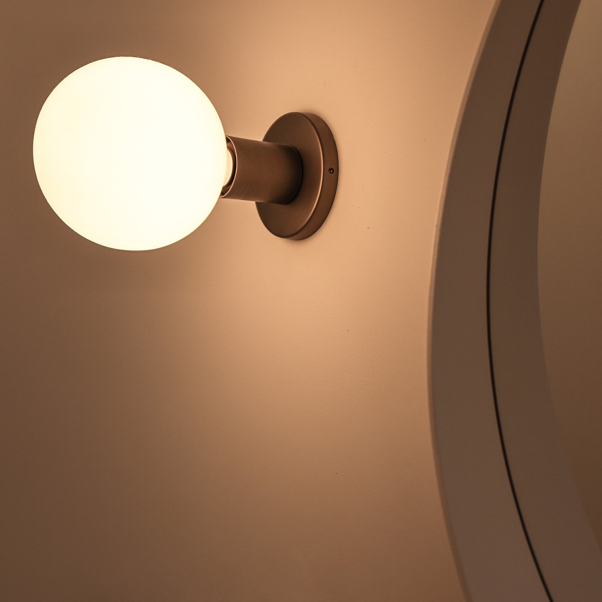 Tala Lochan Wall Light in Graphite + Sphere III in a styled interior setting