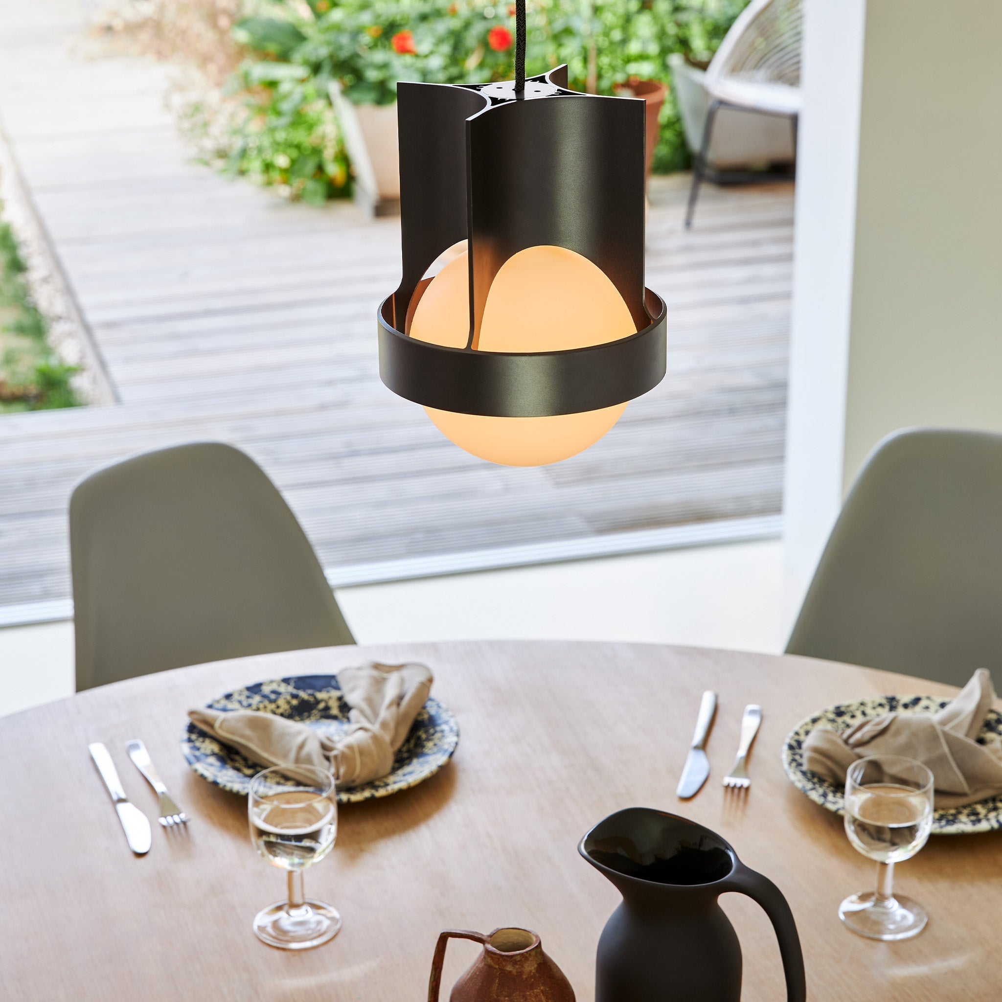 Tala Loop Single Pendant in Dark Grey + Sphere IV in a styled interior setting
