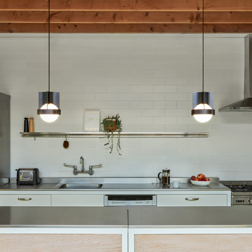 Tala Loop Single Pendant in Dark Grey + Sphere IV in a styled interior setting (view 2)