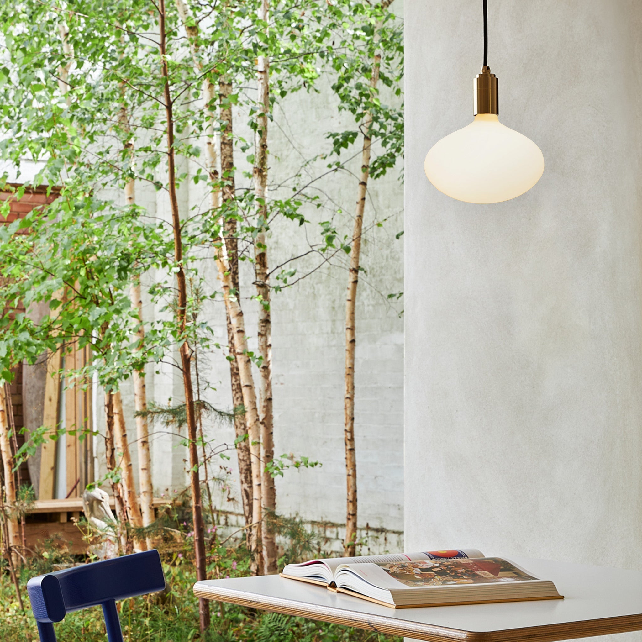 Tala Oval II Pendant Light in Graphite in a styled interior setting