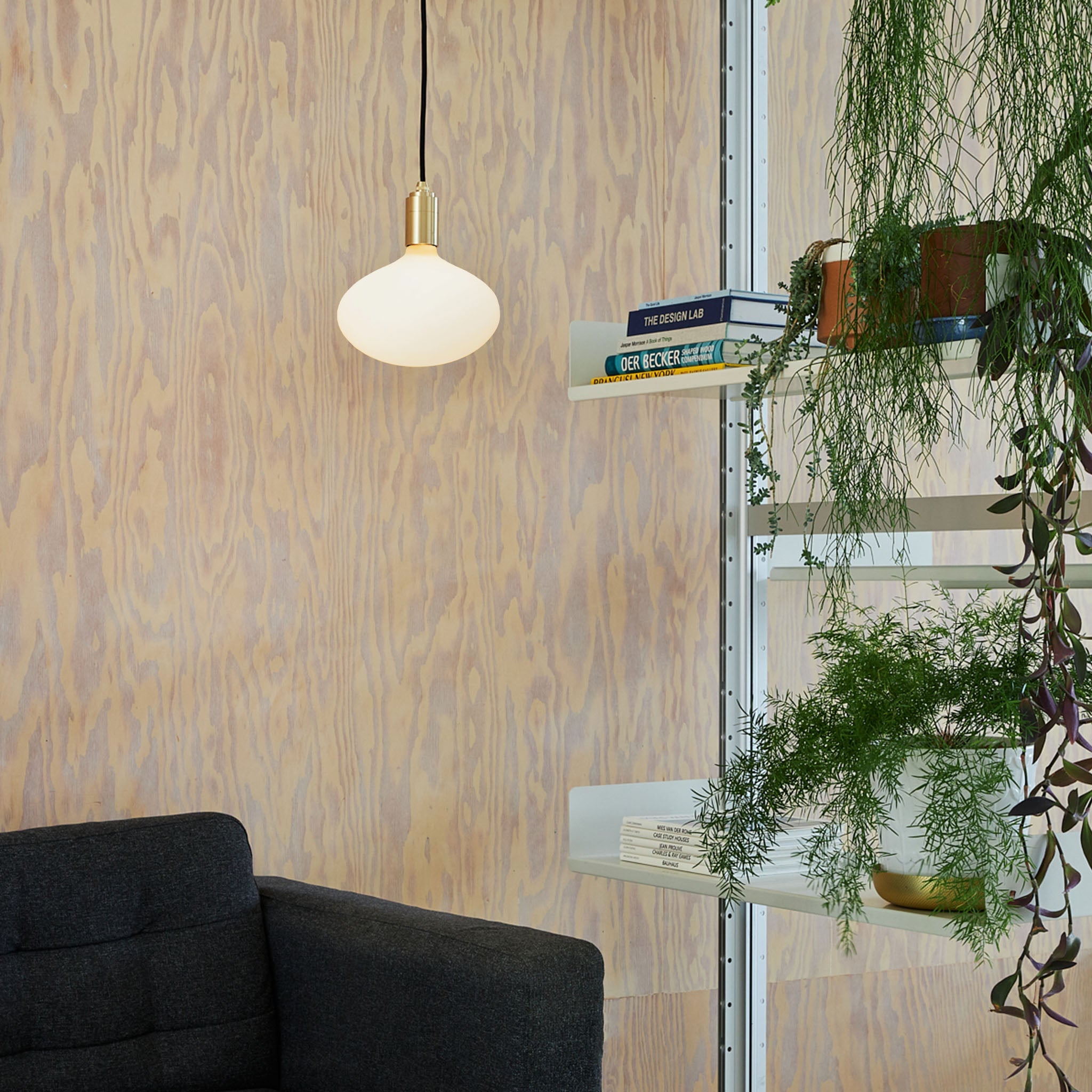 Tala Oval II Pendant Light in Brass in a styled interior setting (view 2)