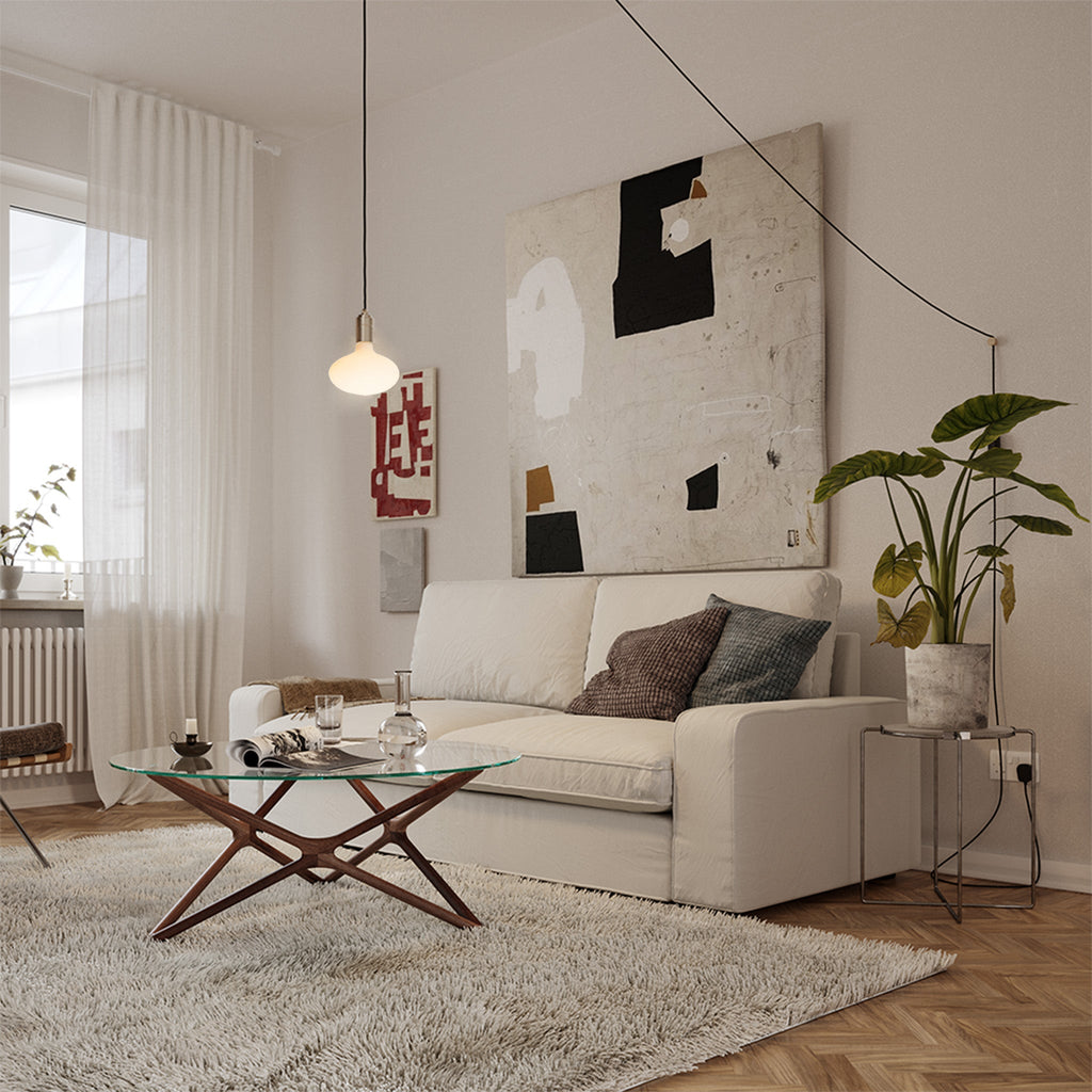 Tala Oval Plug-In Pendant in Graphite in a styled interior setting