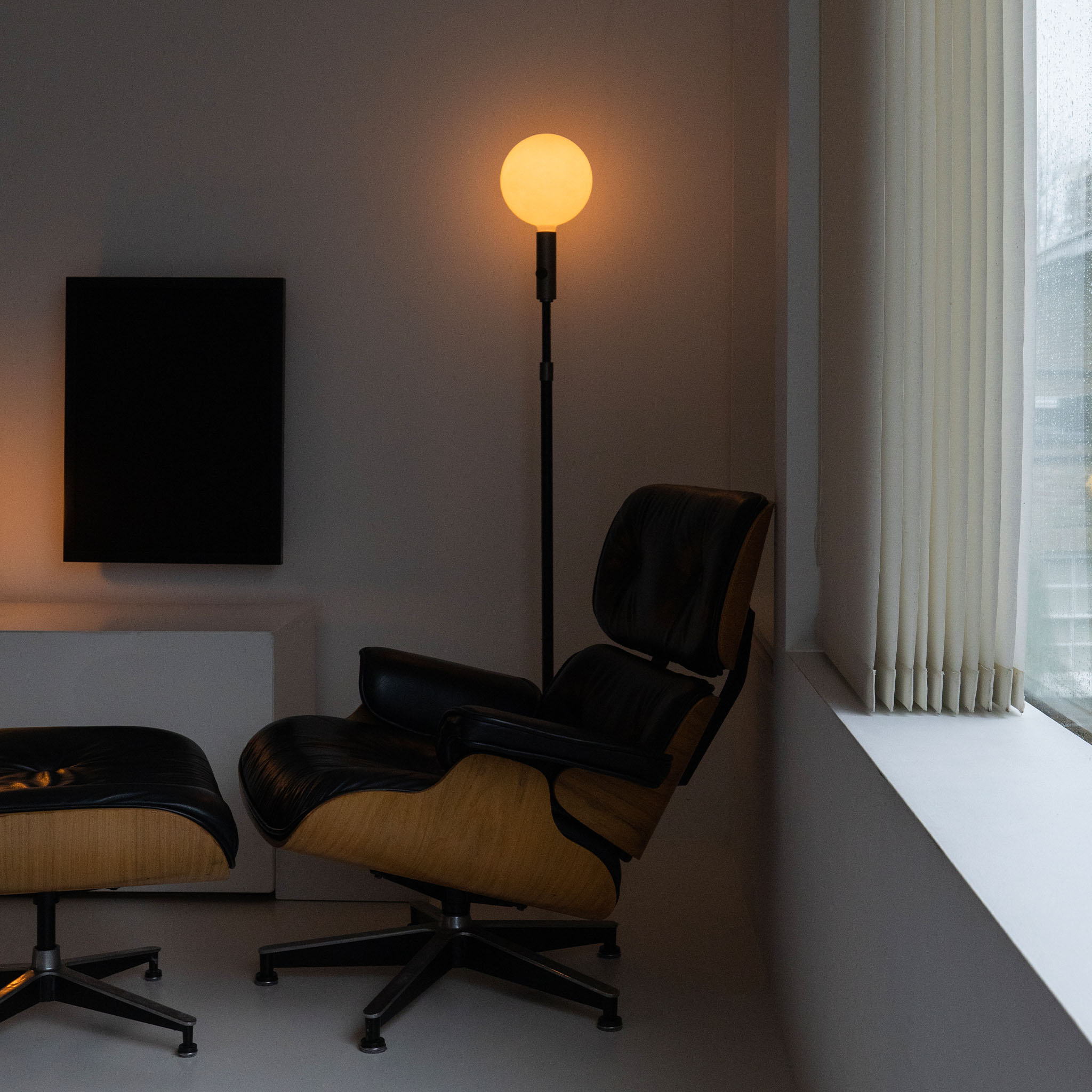 Tala Poise Adjustable Floor Lamp in Graphite + Sphere V in a styled interior setting (view 2)