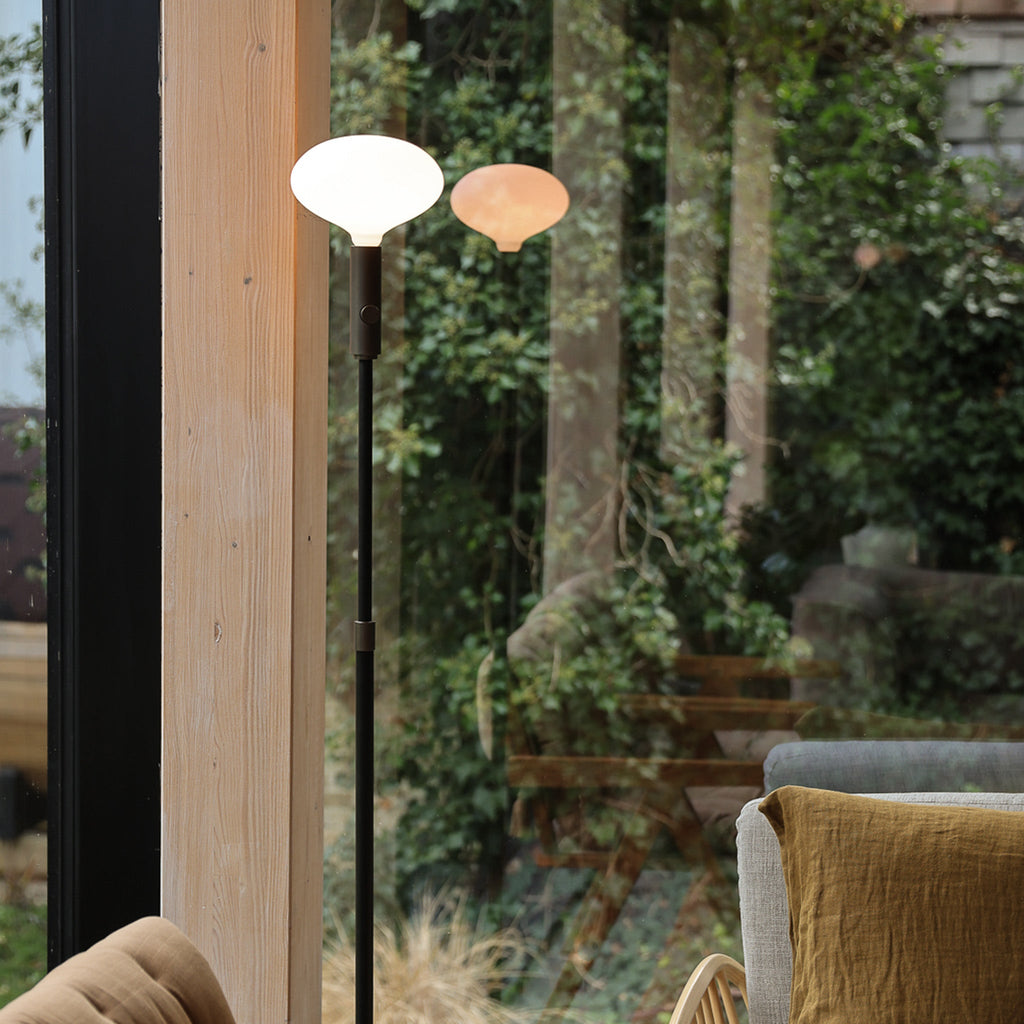 Tala Poise Adjustable Floor Lamp in Graphite + Oval II in a styled interior setting (view 2)