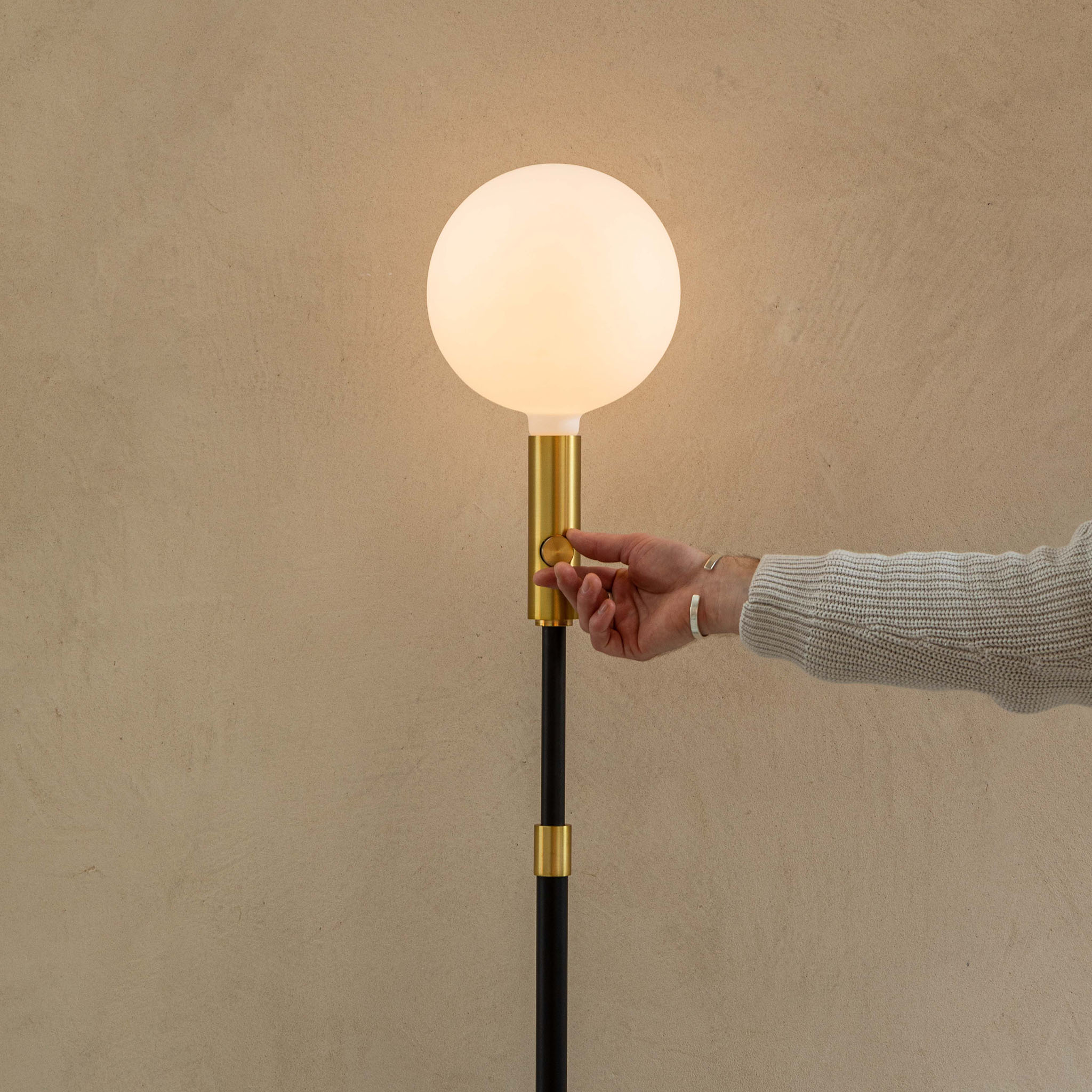 Tala Poise Adjustable Floor Lamp in Brass in a styled interior setting (view 3)