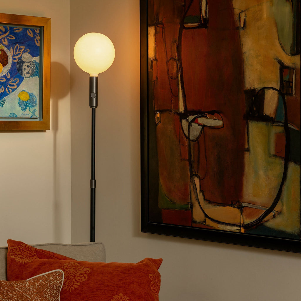 Tala Poise Adjustable Floor Lamp in Graphite + Sphere V in a styled interior setting (view 4)