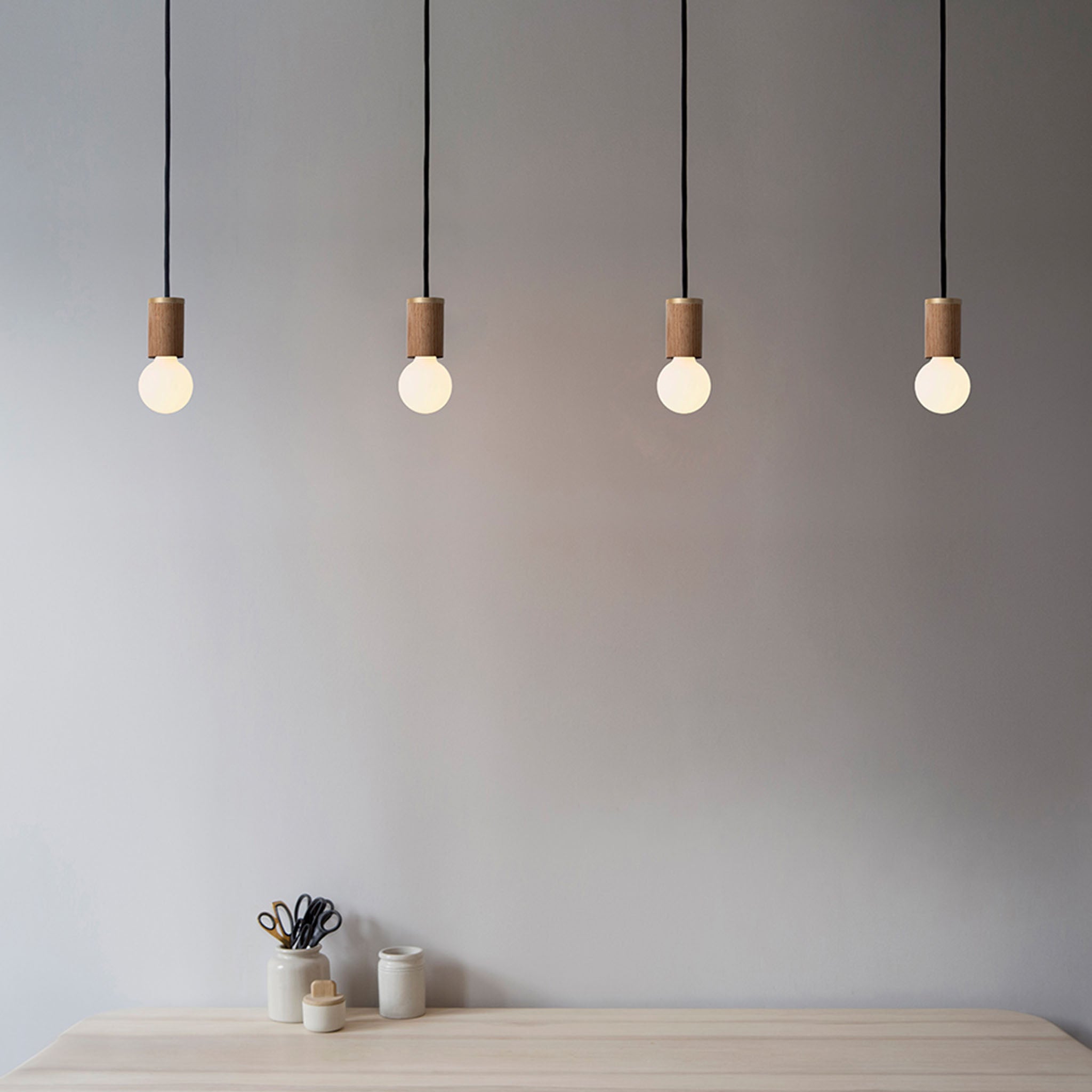 Tala Porcelain II Pendant Light in Oak in a styled interior setting