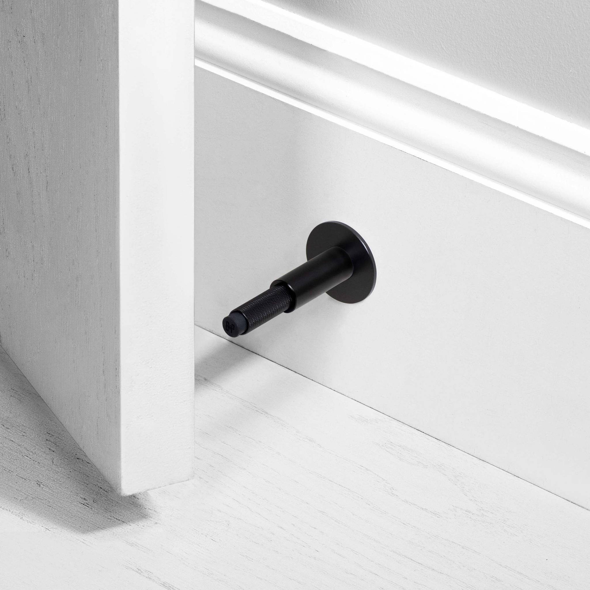 Buster + Punch Door Stop Wall Cross in Black