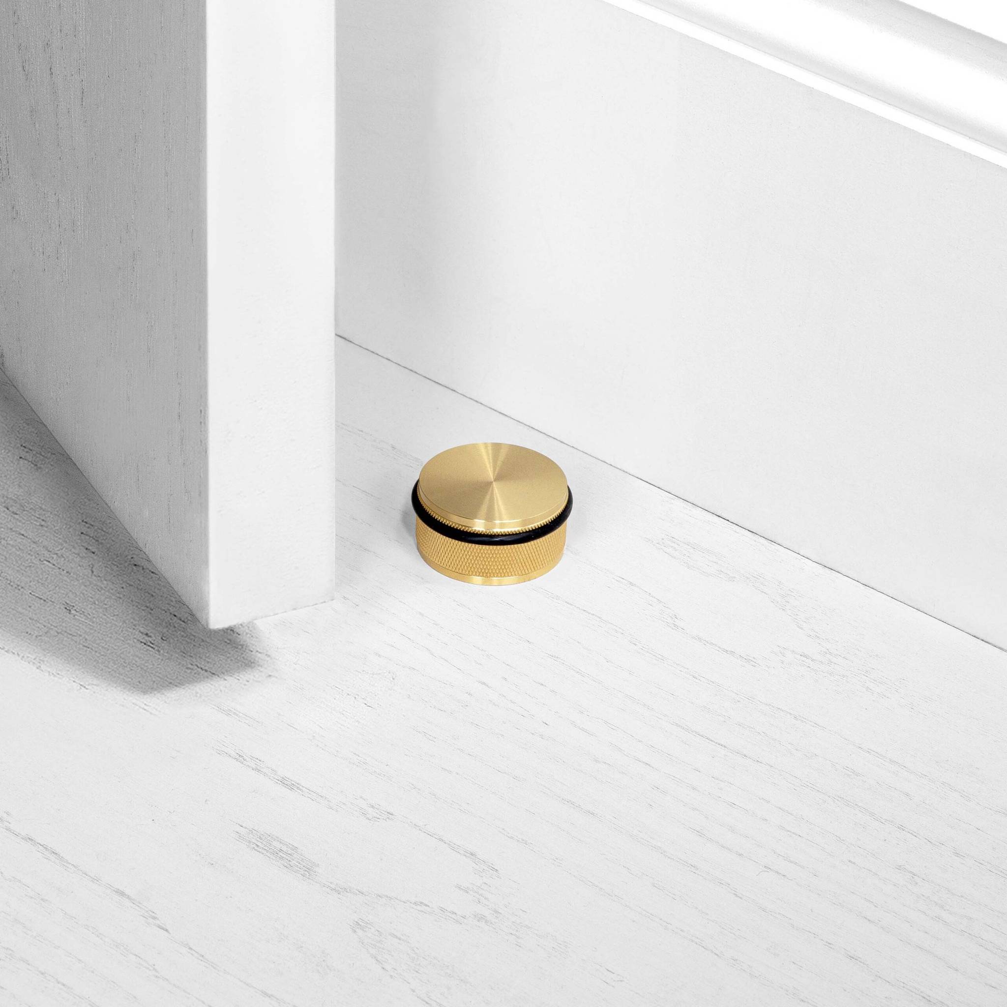 Buster + Punch Door Stop Floor Mounted Cross in Brass
