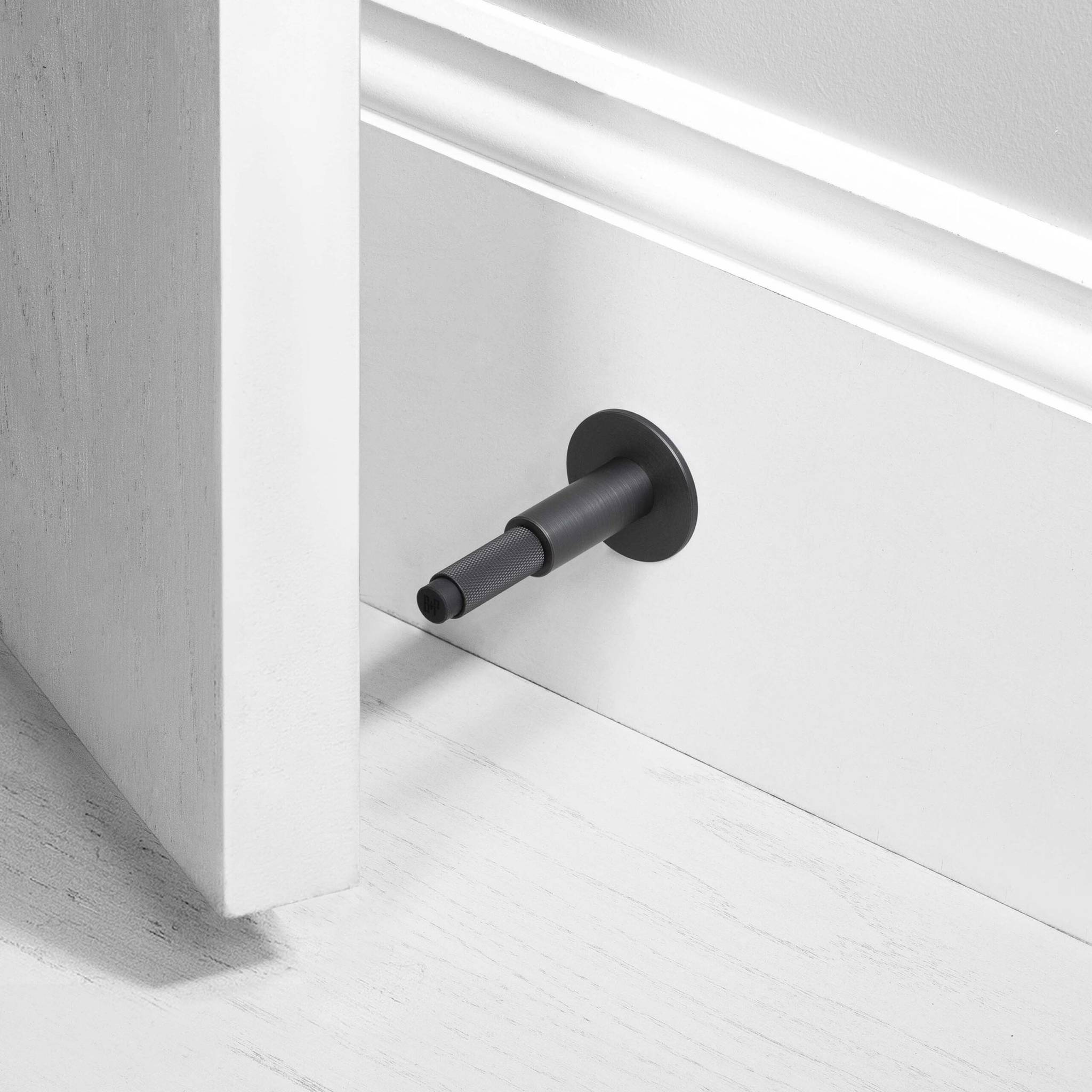 Buster + Punch Door Stop Wall Cross in Smoked Bronze