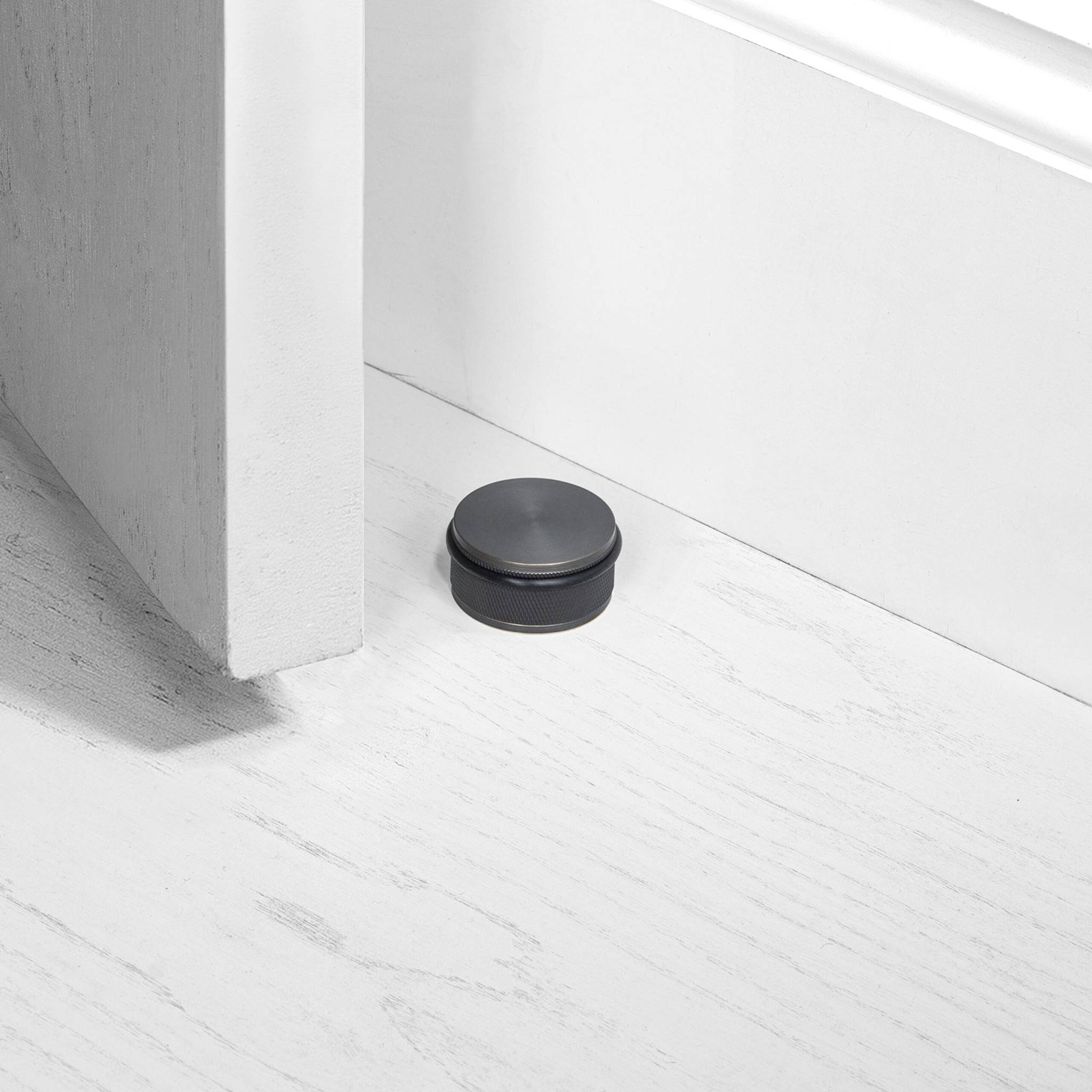 Buster + Punch Door Stop Floor Mounted Cross in Smoked Bronze