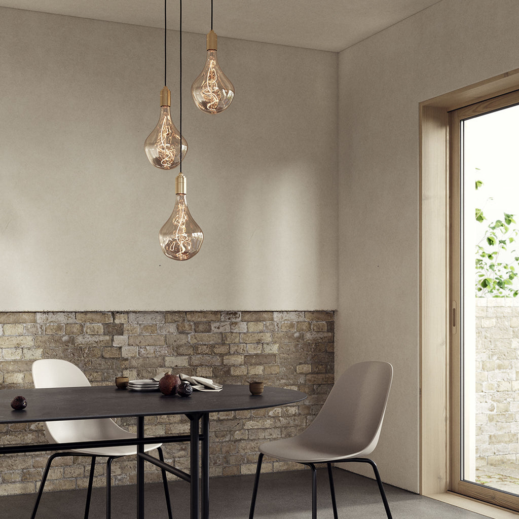 Tala Triple Pendant in Brass + Voronoi II in a styled interior setting (view 3)