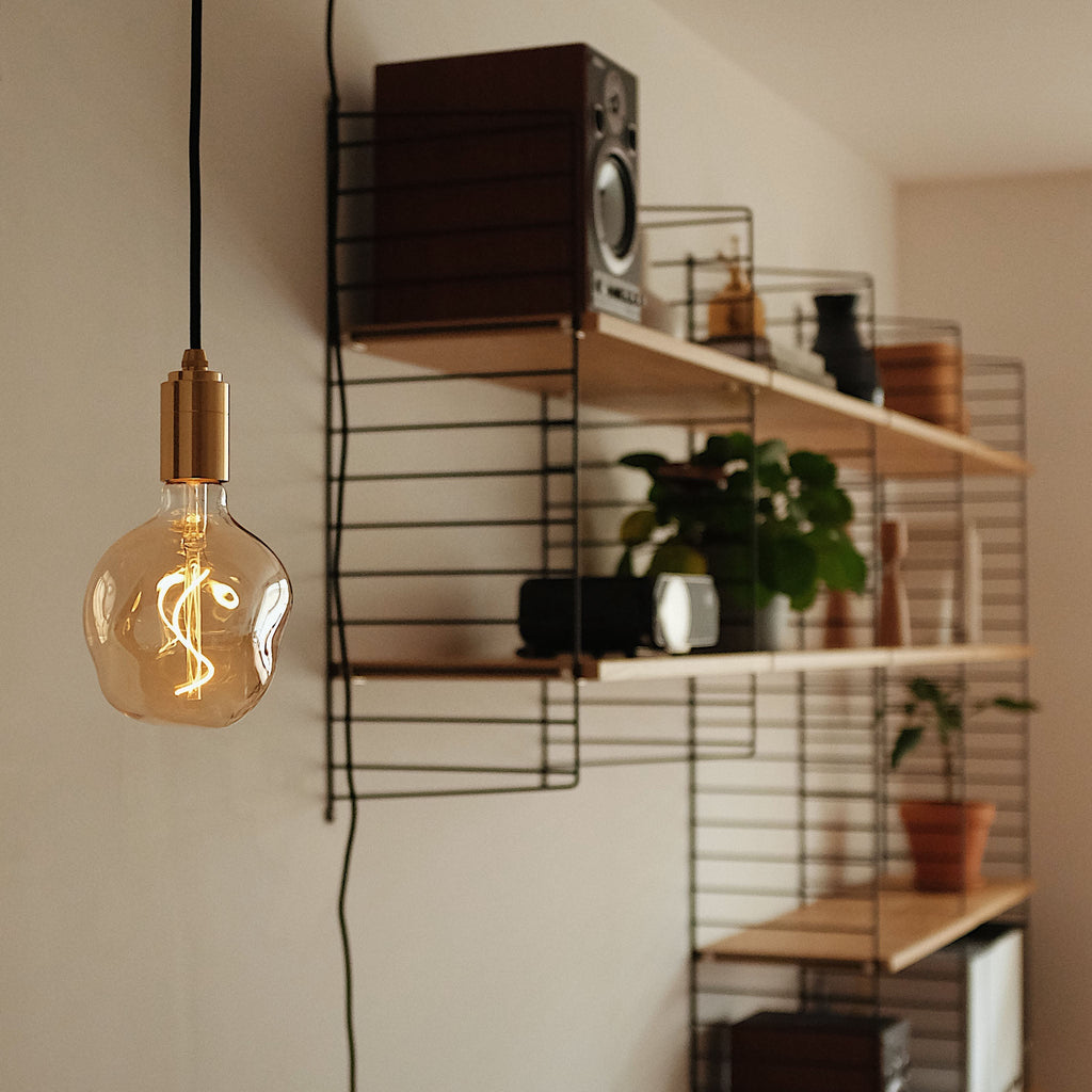 Tala Voronoi I Pendant Light in Brass in a styled interior setting